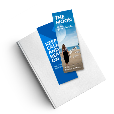 Vibrant full-color 2x6 inch bookmarks laying flat on a white book